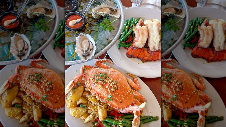 Bay Area seafood spread at Fog harbor fish house with crab and oysters on white plates