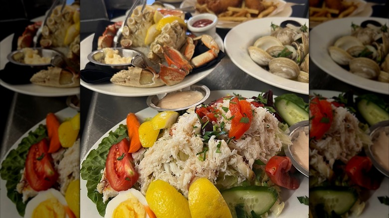 Bay Area seafood spread with crab louie salad and steamed crab on a table