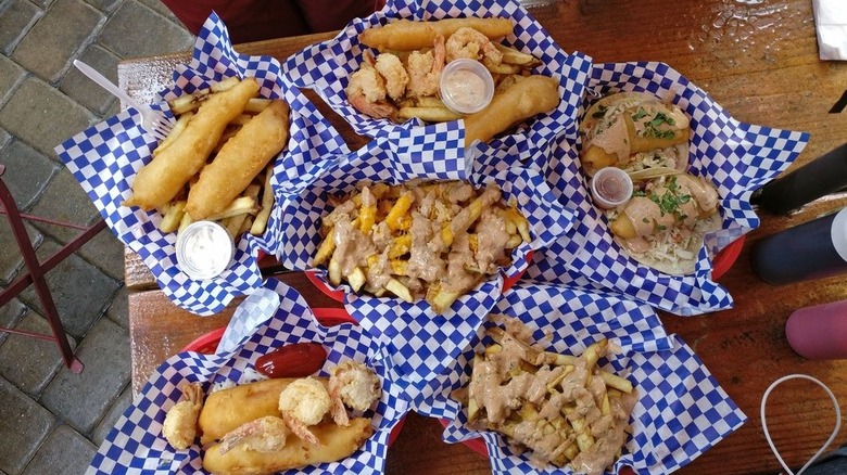 A fried food spread from a Bay Area seafood restaurant with blue and white checkered paper