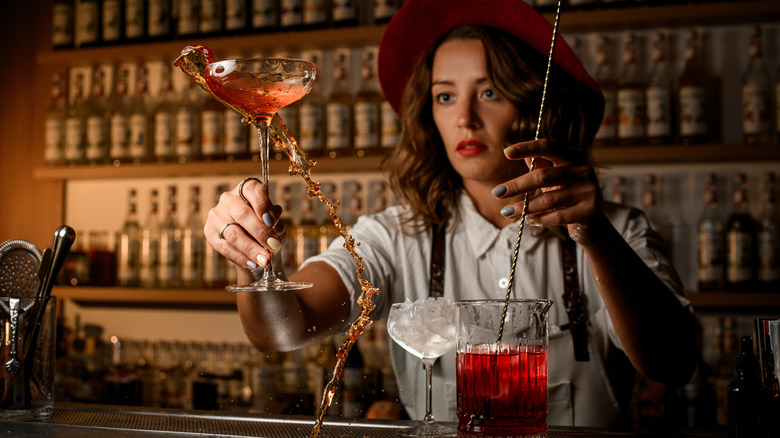Woman stirring a cocktail