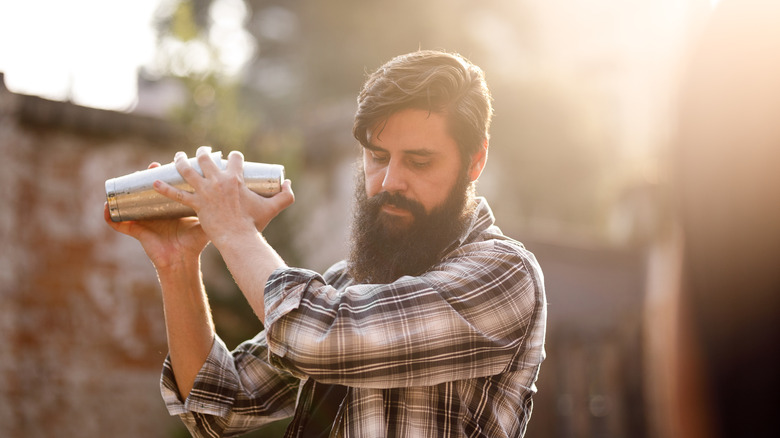 Bartender shaking a cocktail