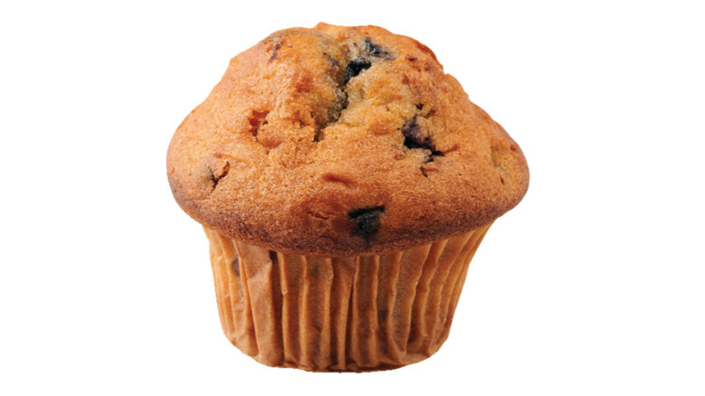 Single blueberry muffin on white background