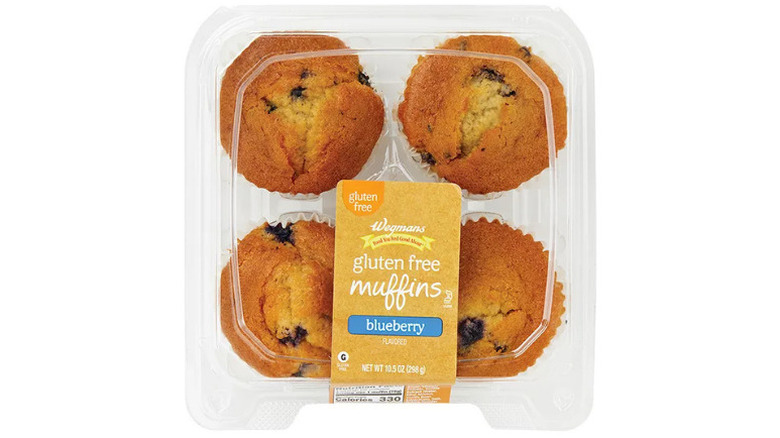 Plastic container of four gluten-free blueberry muffins from Wegmans with visible label