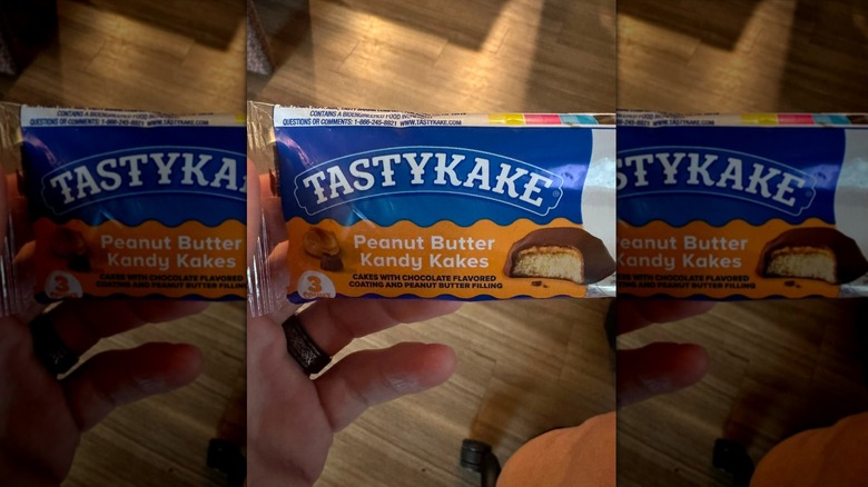 Hand holding Tastykake Peanut Butter Kandy Kake in package