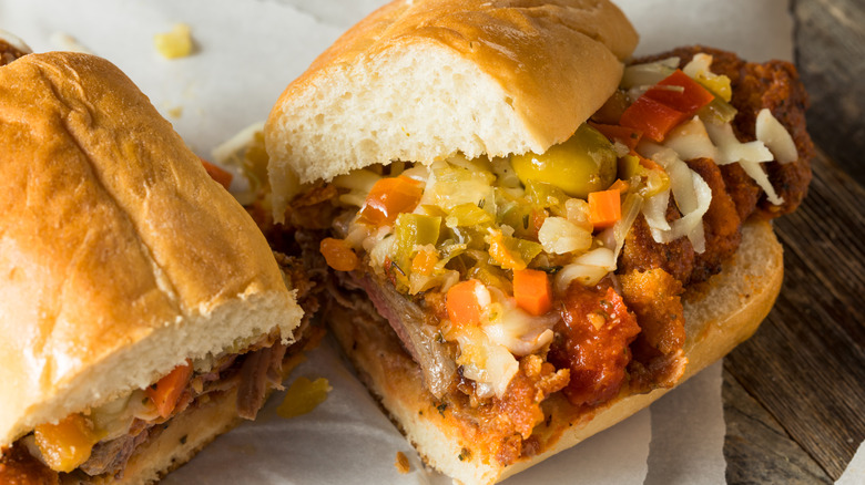 Breaded steak sandwich with topping on paper