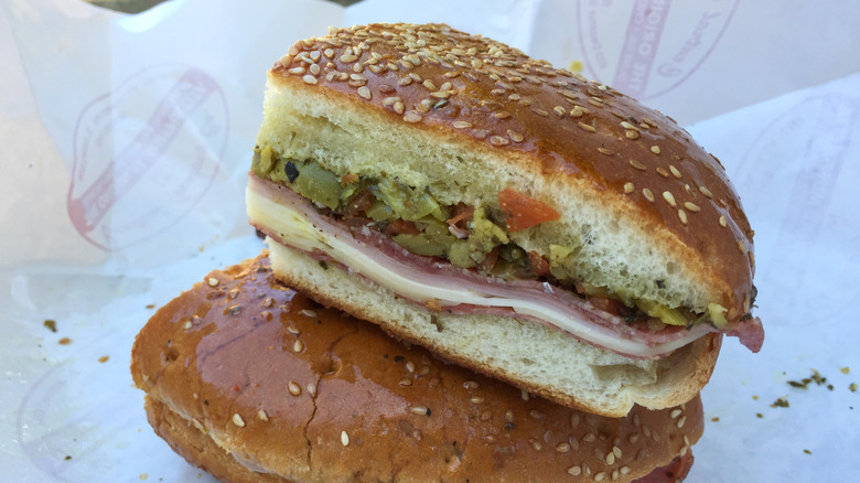 Muffuletta sandwich in paper wrapper