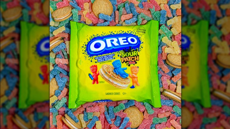 Package of Sour Patch Kids Oreos with Sour Patch candies in background