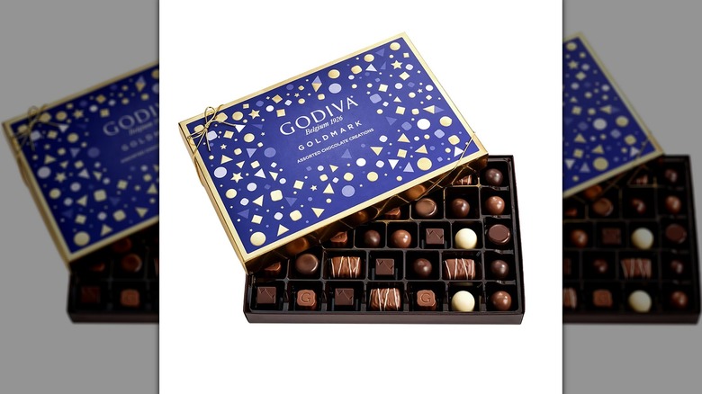 Open box of Godiva Goldmark Collection assorted chocolates.