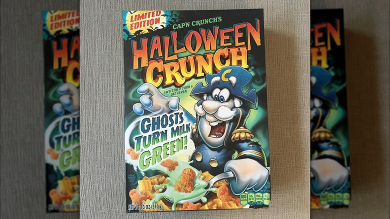 Cap'n Crunch's Halloween Crunch cereal sits against a brown-gray background.