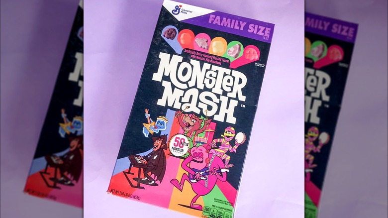 A box of Monster Mash cereal sits against a purple background.