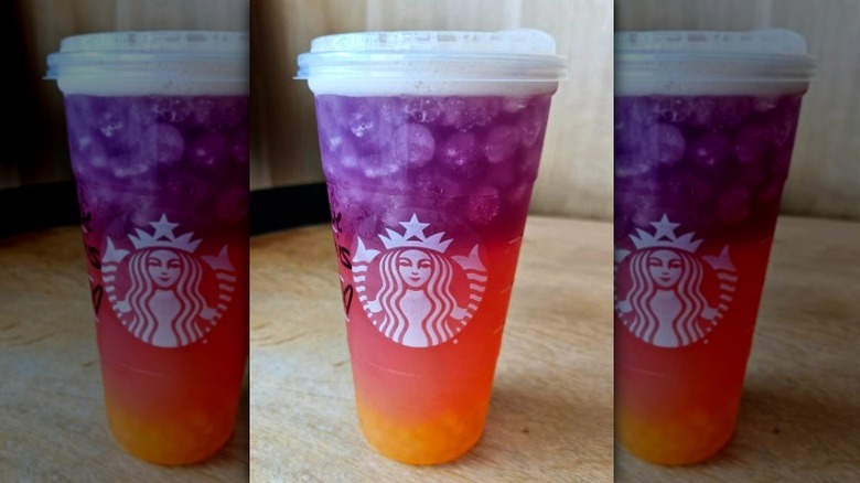 a Starbucks Tropical Butterfly Lemonade Refresher on wood table