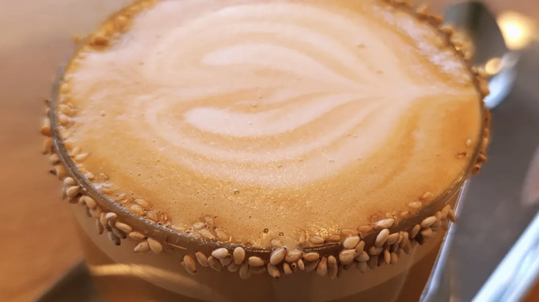 Close up of a seeded miso caramel latte.