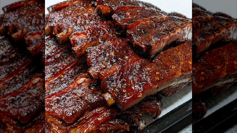 Plate piled with racks of ribs