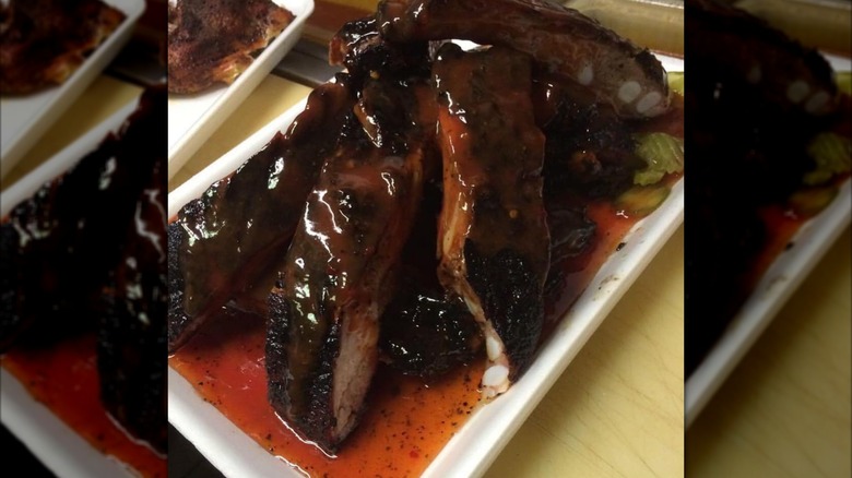 Saucy ribs on a white plate