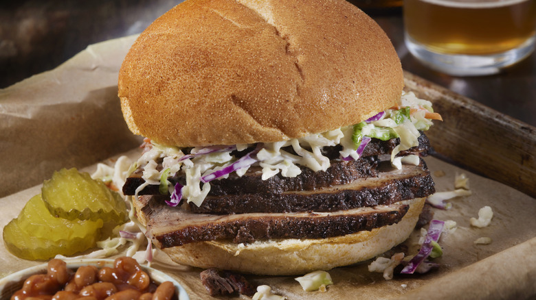 Brisket sandwich with coleslaw and pickles