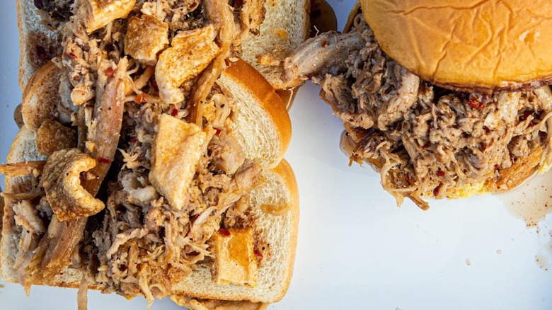 Pulled pork sandwich and open-faced pork sandwich with pork rinds