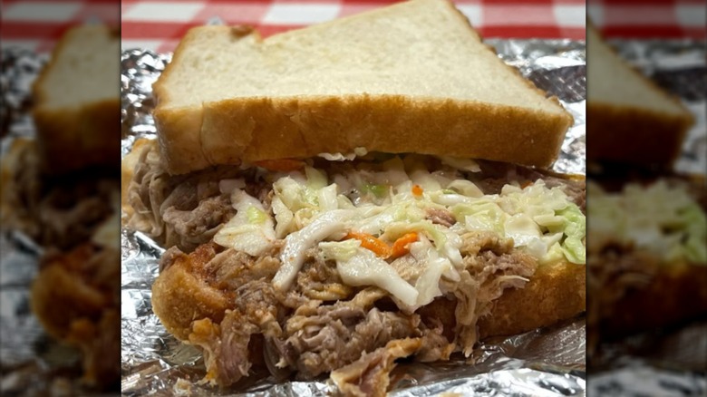 Pulled pork on Wonder Bread with slaw on foil