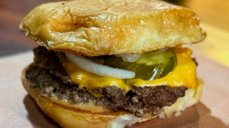 Brisket sandwich with onions, cheese, and pickles