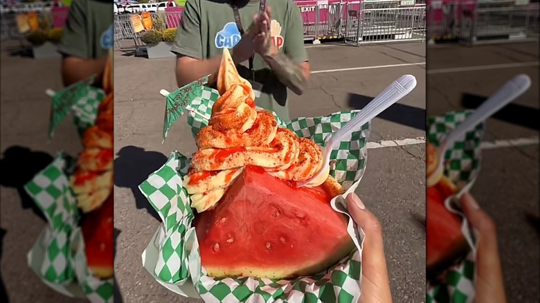 Person holding watermelon taco