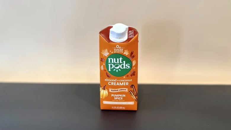 Nut Pods Pumpkin Spice Creamer on black countertop