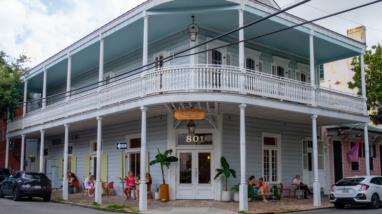 Exterior view of the elegant Ayu Bakehouse with customers
