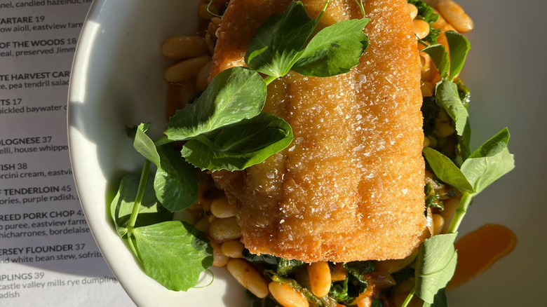Corn-fried New Jersey Flounder with greens on plate at One Coastal