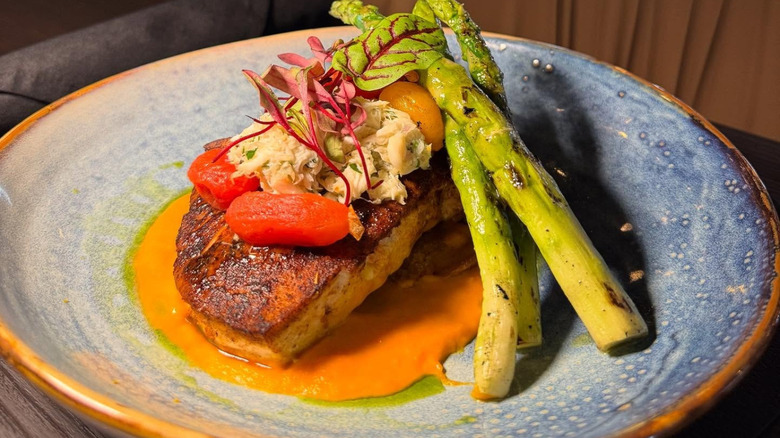 Spanish swordfish with asparagus on plate at Pithari