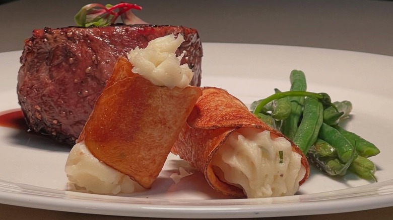 Potato canoli and green beans on plate at Vita Nova Restaurant