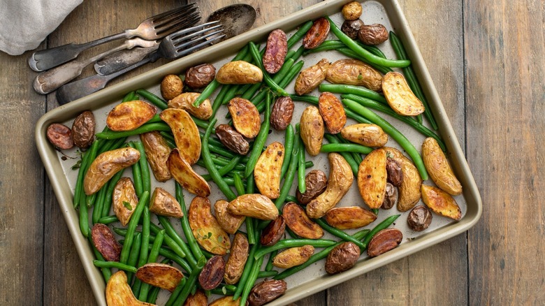 Potatoes and green beans on sheet pan