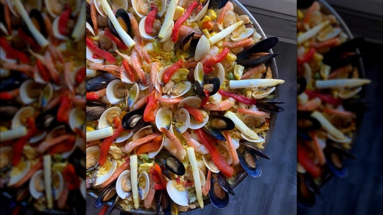 Paella outside with blue floor in background