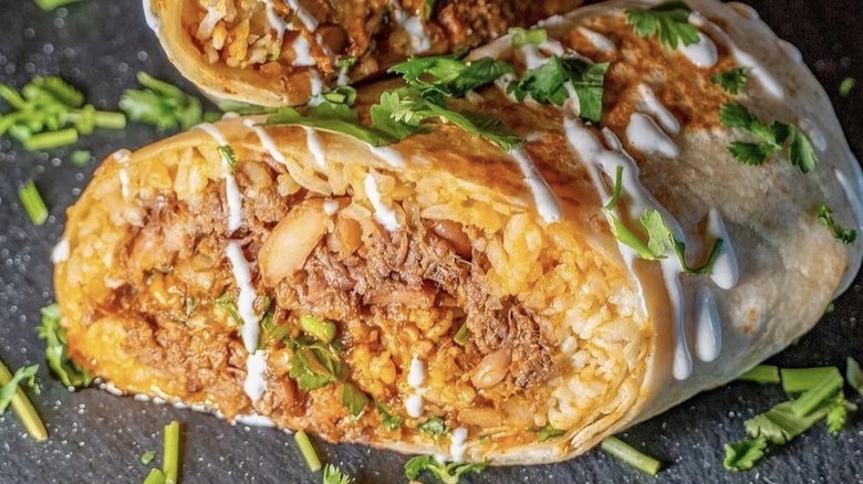 Burrito with rice, meat, and herbs
