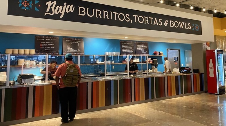 Colorful burrito ,torta, and bowl counter at Mexico Ceaty food hall