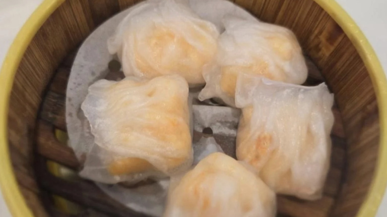 Steamed shrimp dumplings in a wooden basket