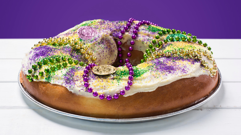 king cake on a white and purple background