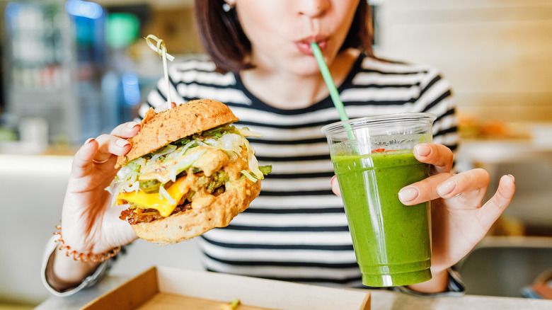 Woman eating vegan fast food