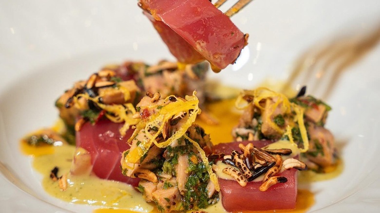 Plate of tuna with puffed wild rice and chile
