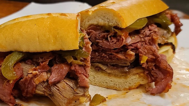 Roast beef and pastrami sub sliced on paper