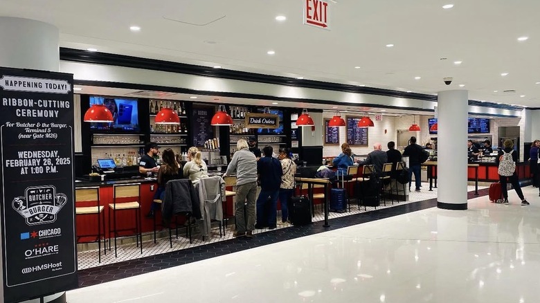 Customers dining at the bar in airport terminal
