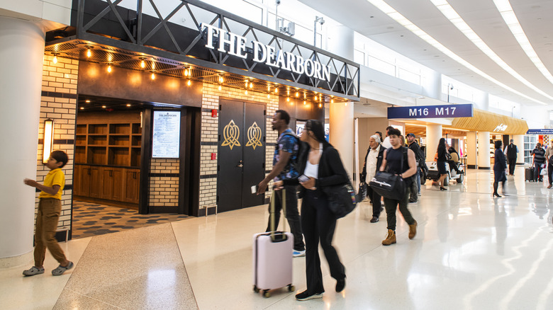 Travelers walk through the terminal at O'Hare International Airport
