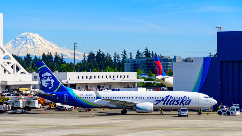 Sea-Tac airport and plane with Mount Rainier in the background