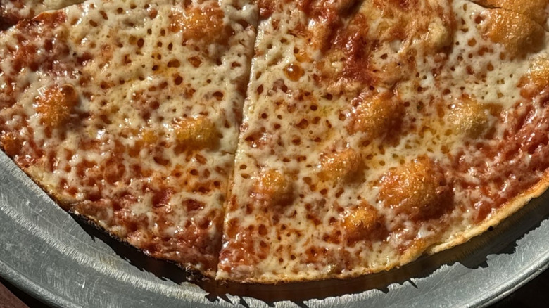 Pizza from Colony Grill on a metal plate