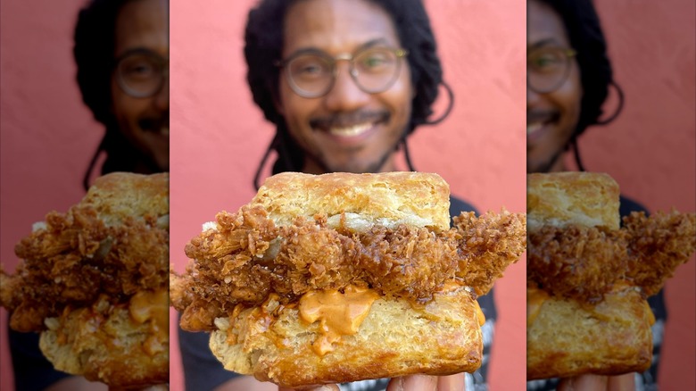 Smiling Bird Bird Biscuit owner holding chicken biscuit