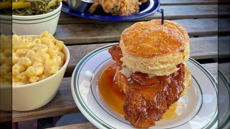 Chicken biscuit on plate with mac and cheese