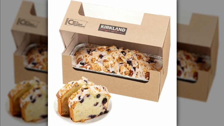 Costco Kirkland Signature lemon blueberry loaf in tin placed inside a branded Kirkland Signature brown paper bakery box.