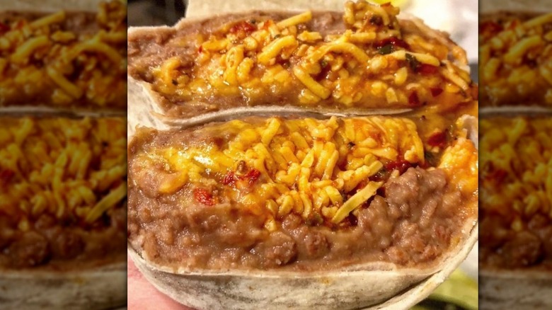 Close-up of a bean and cheese burrito sliced in half