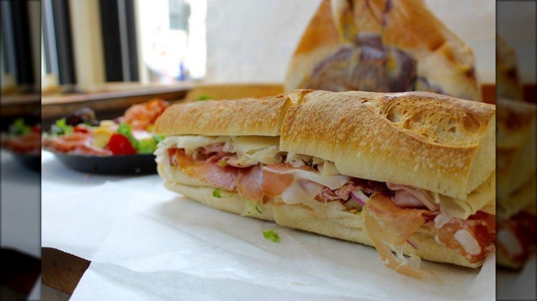 Close-up of a meat and cheese sub cut in half from Monica's Mercato & Salumeria