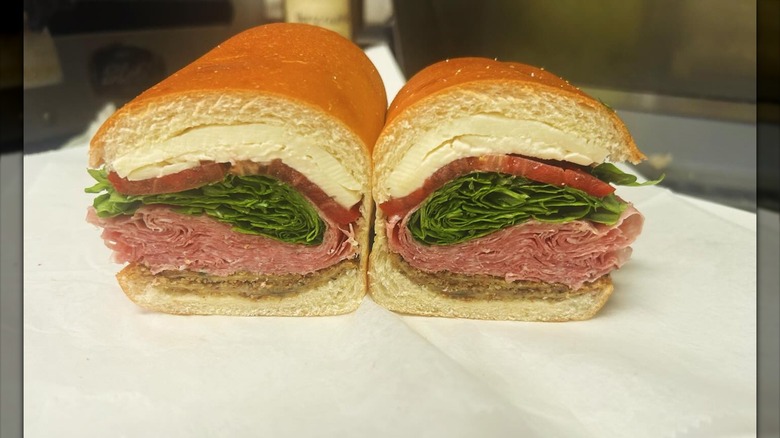 Close-up of an Italian sub sandwich from V&S Italian Deli filled with salami and fried eggplant