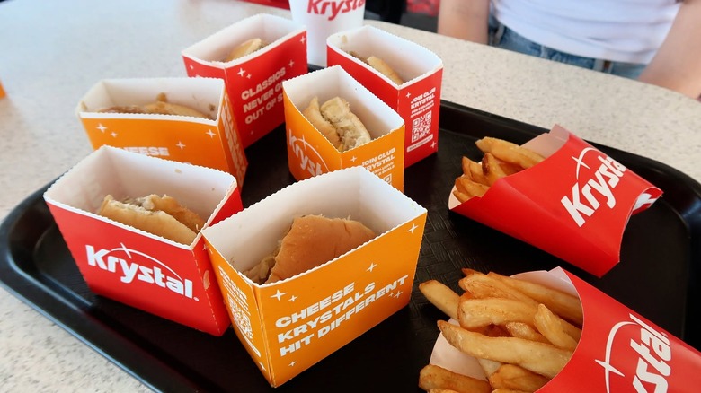 A platter of Krystal sliders and two packets of French fries