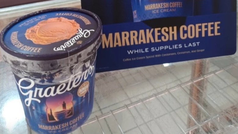 A pint of Graeters Marrakesh Coffee ice cream next to a sign that says the same