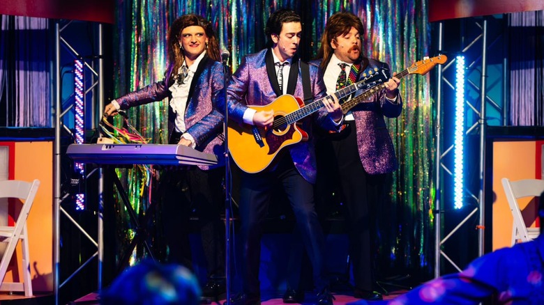 Three people on stage in The Wedding Singer